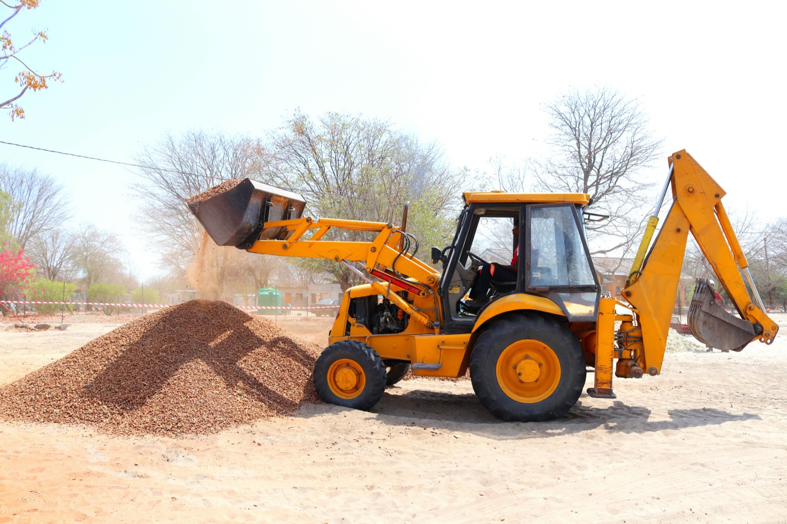 Front-end loader moving dirt at a construction site